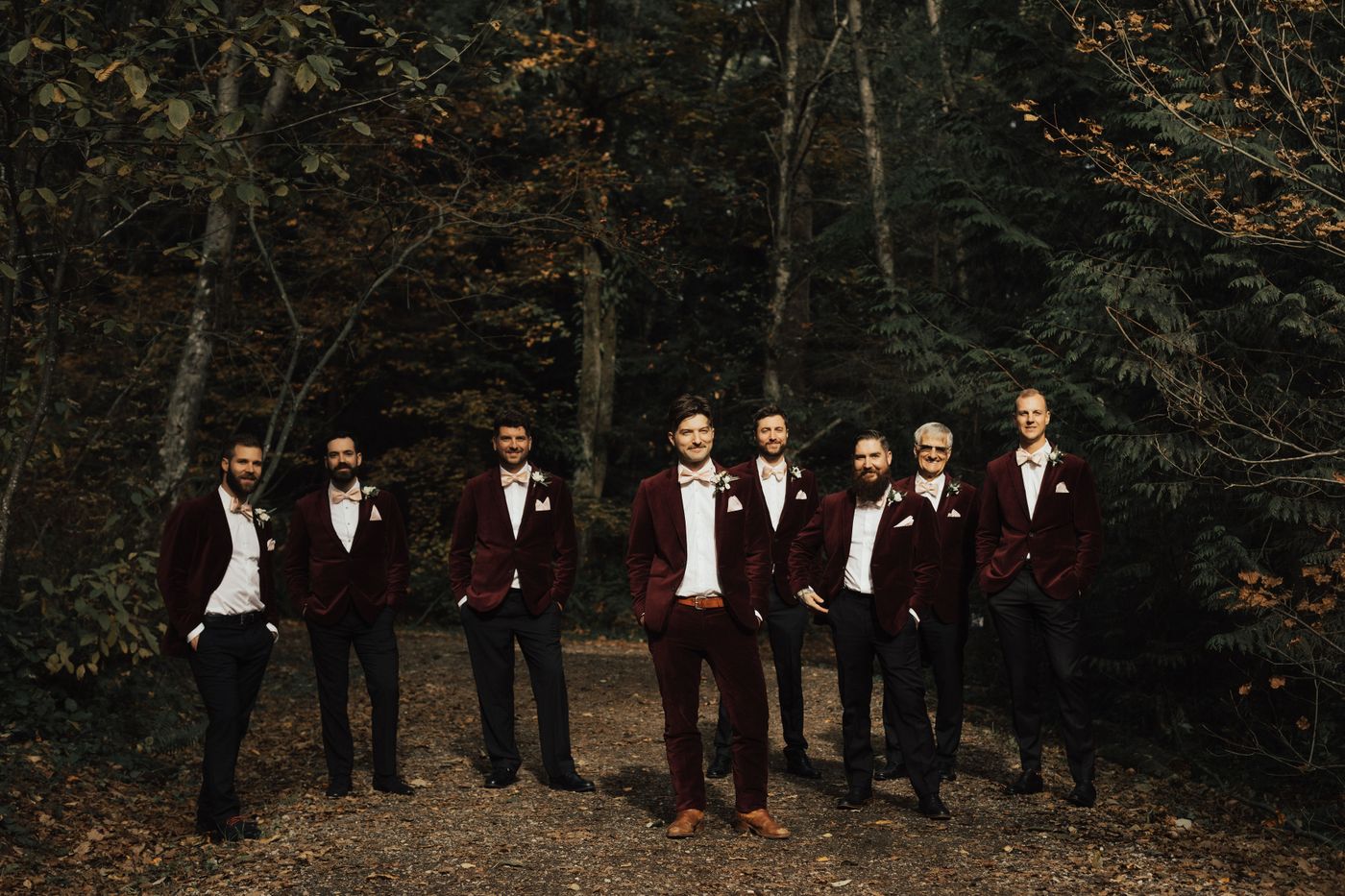 Image of groom and groomsmen dressed in red velvet suits