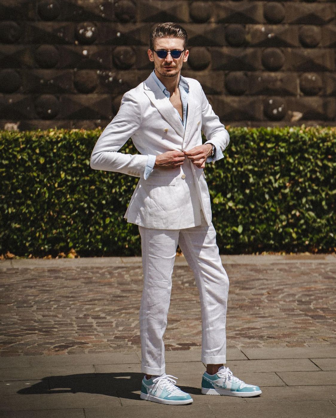 White casual suit with blue sneakers