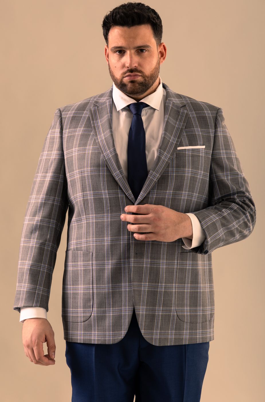 Suit with patched pocket