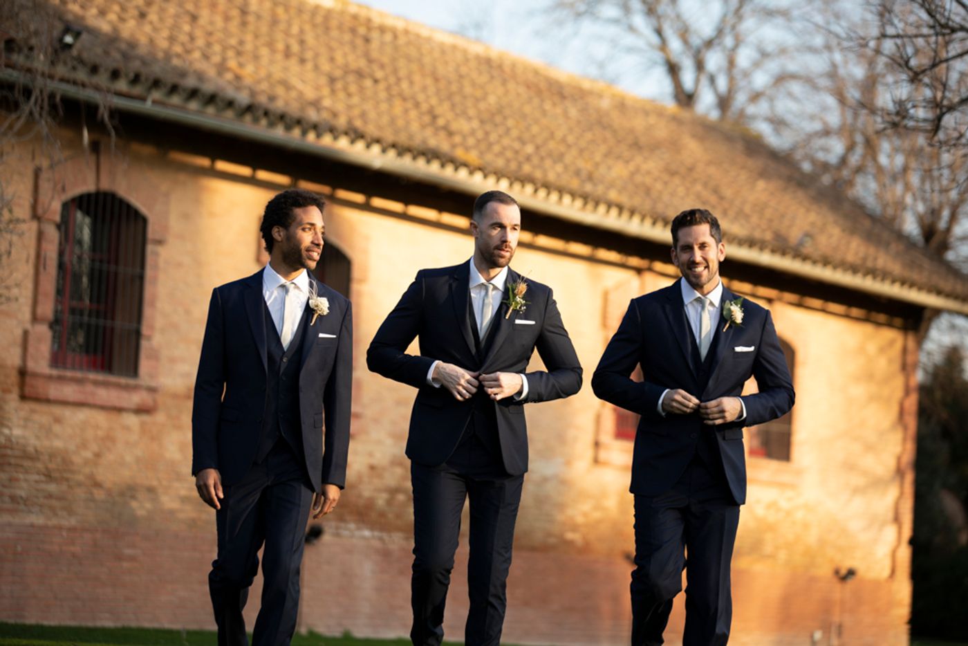groomsmen wearing navy blue suits